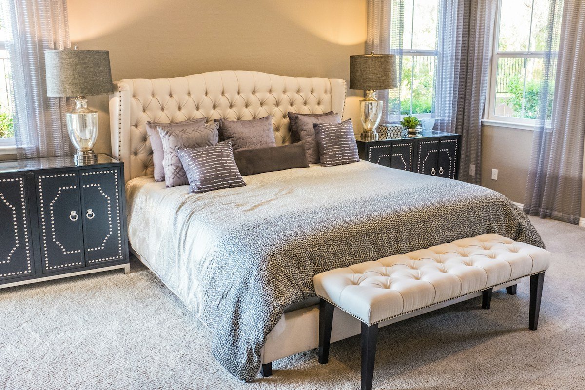 Comfortable, naturally lit bedroom with soft bedding
